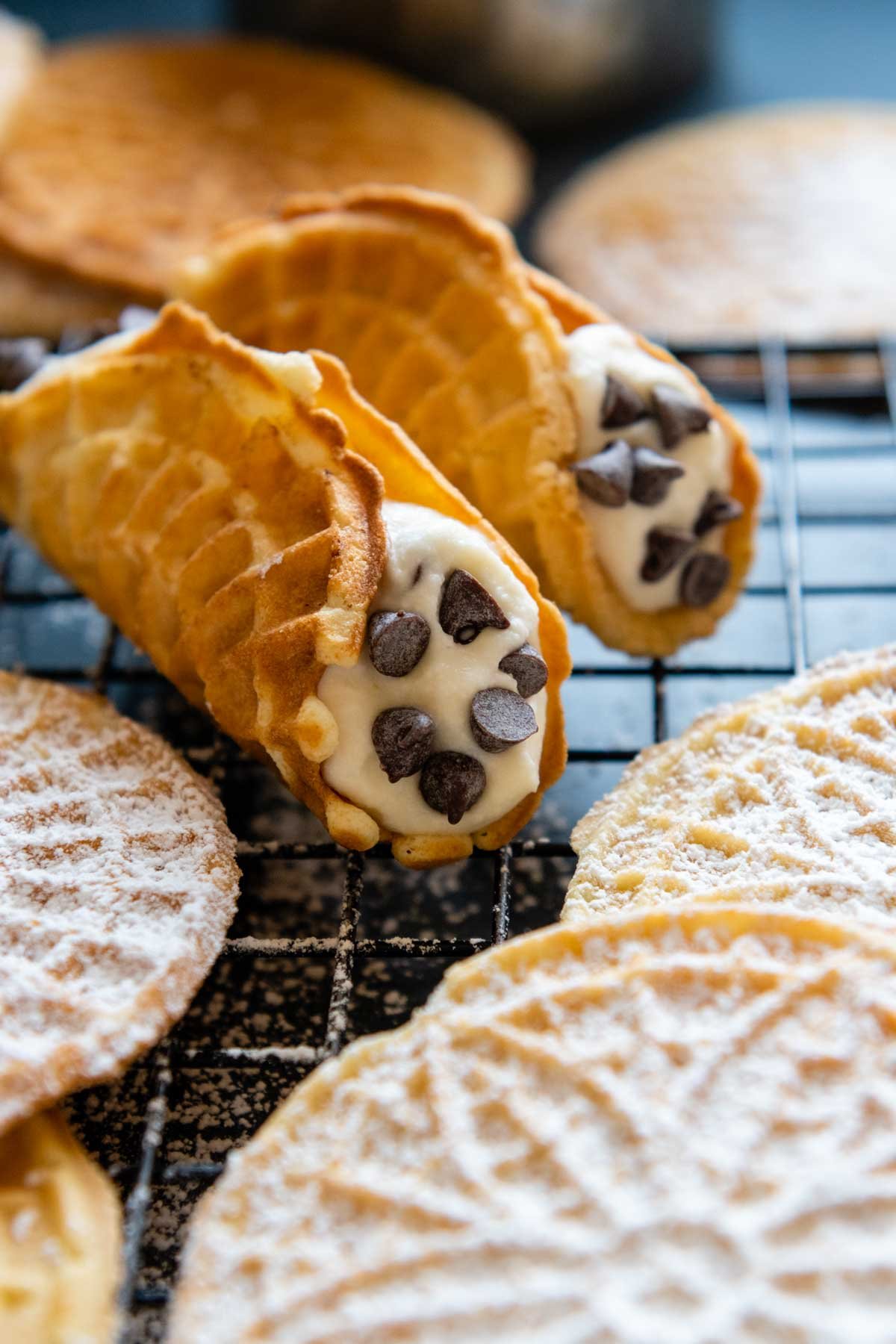 image of pizzelles shaped into cannoli shells