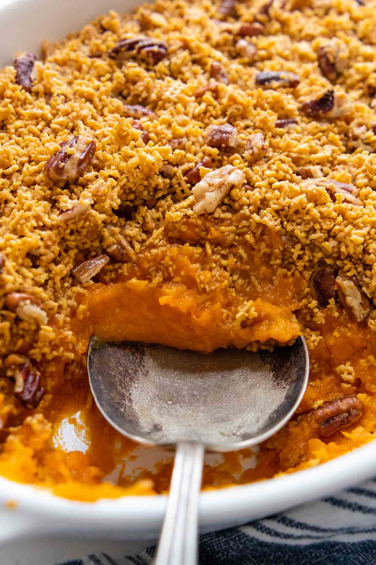a spoon going into the sweet potatoes.