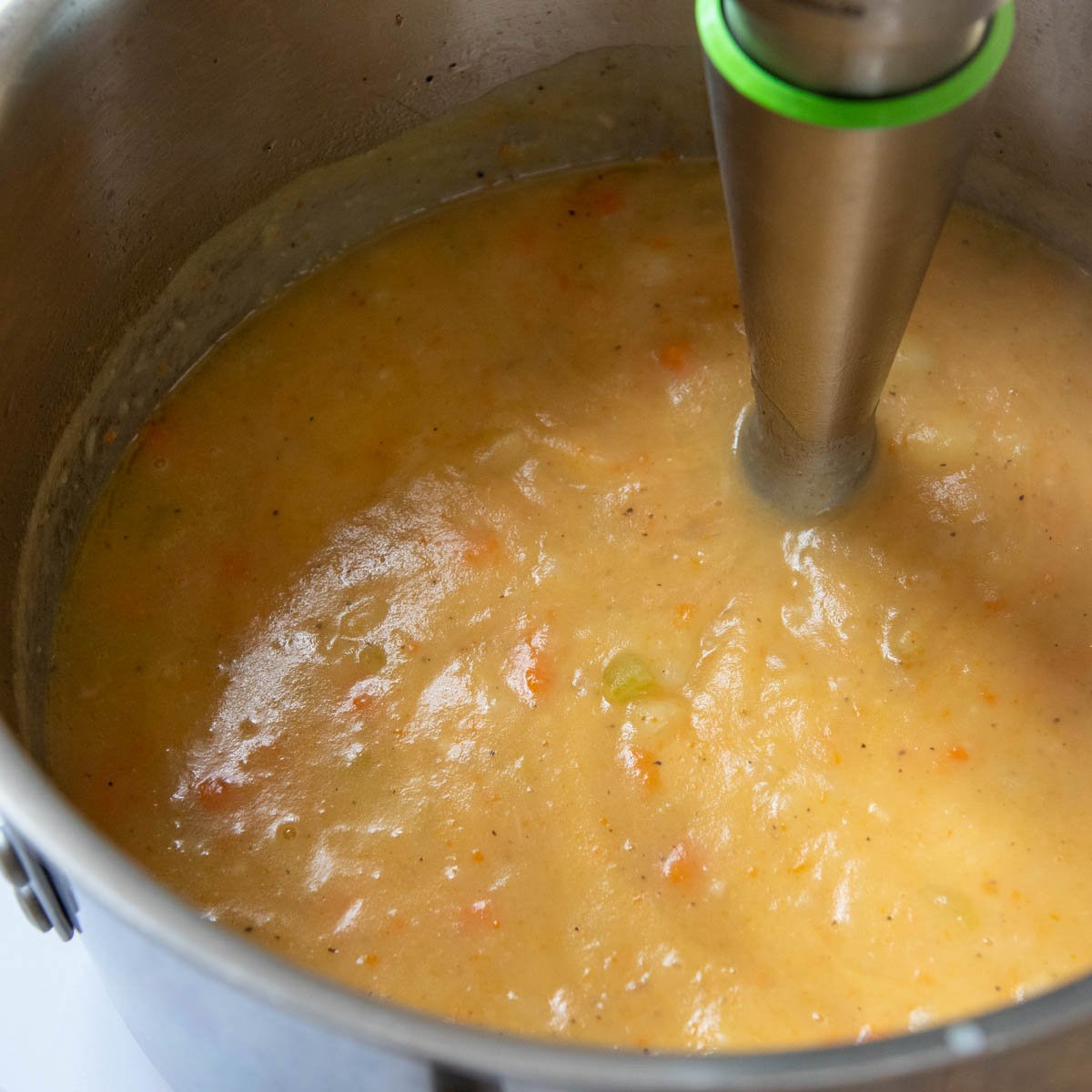 immersion blender pureeing soup.