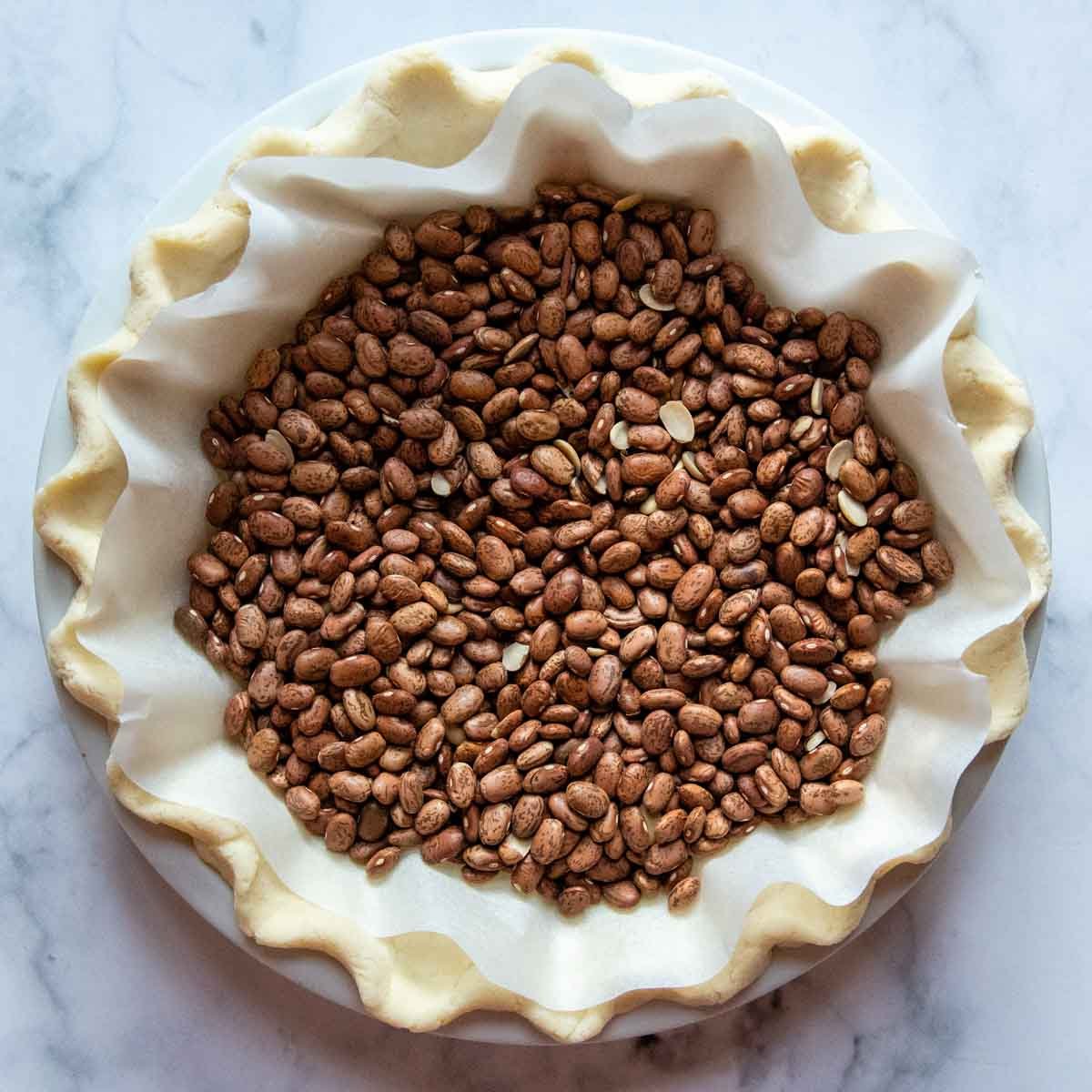 dried beans in an unbaked pie crust.