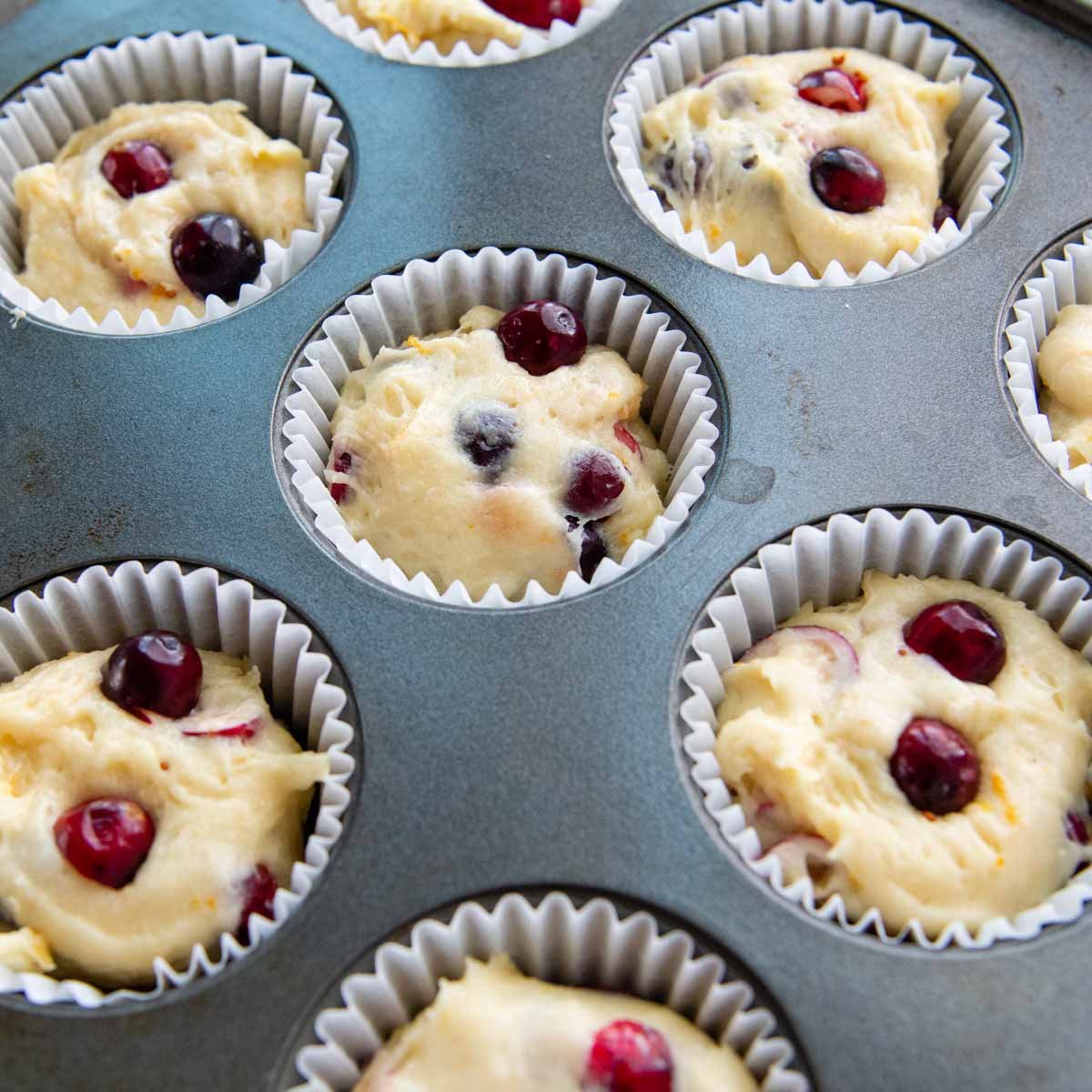 unbaked muffins in a tin.