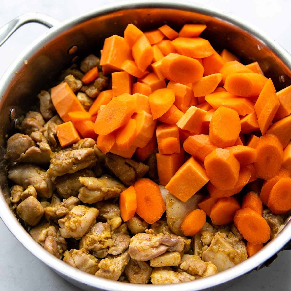carrots and sweet potatoes cooked with chicken.