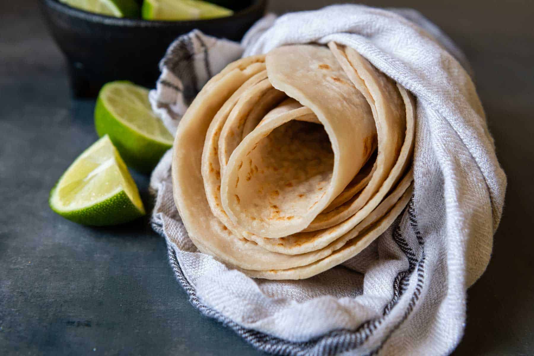 tortillas rolled together and wrapped in a towel.