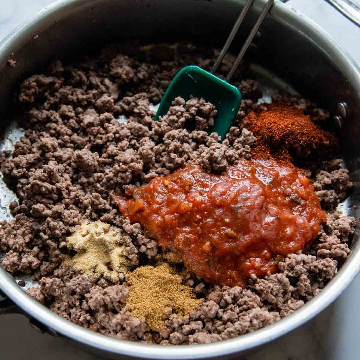 the taco meat being made in skillet.