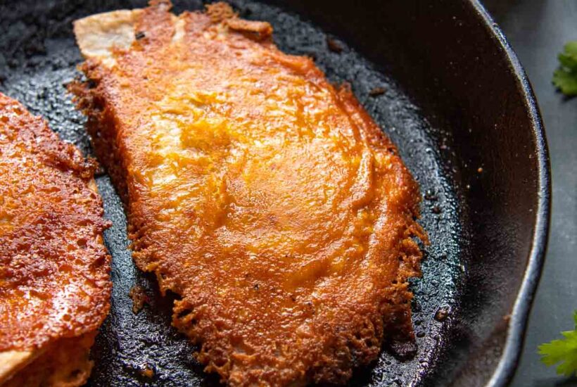 a quesadilla in a frying pan.