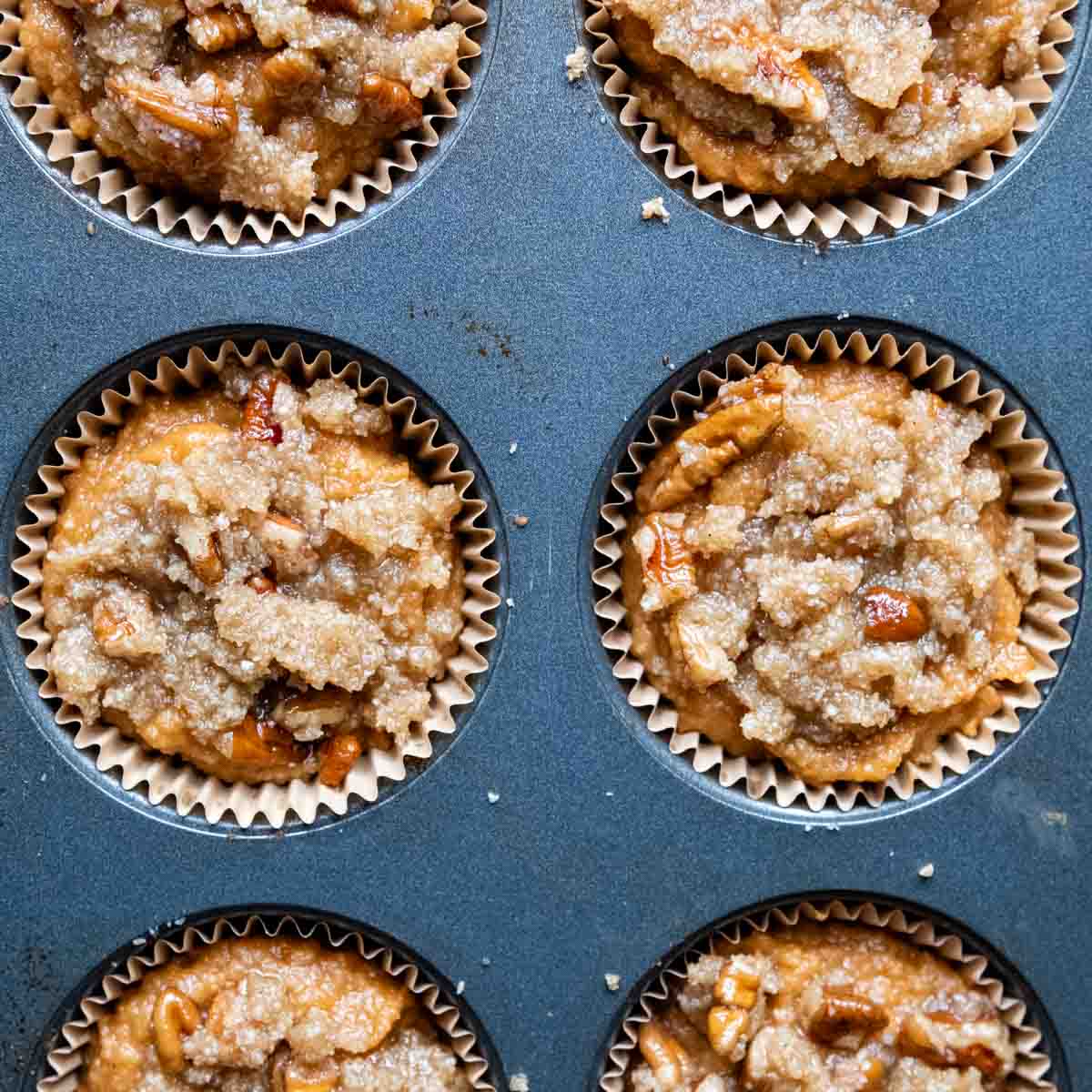 unbaked muffins with streusel on top.