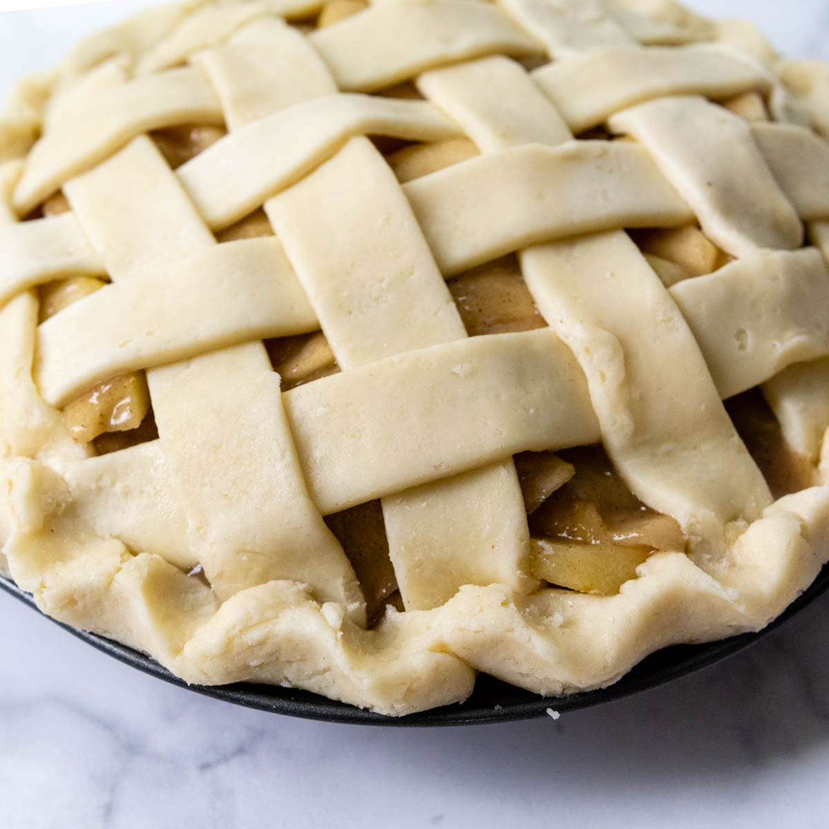 unbaked pie with decorative edge.