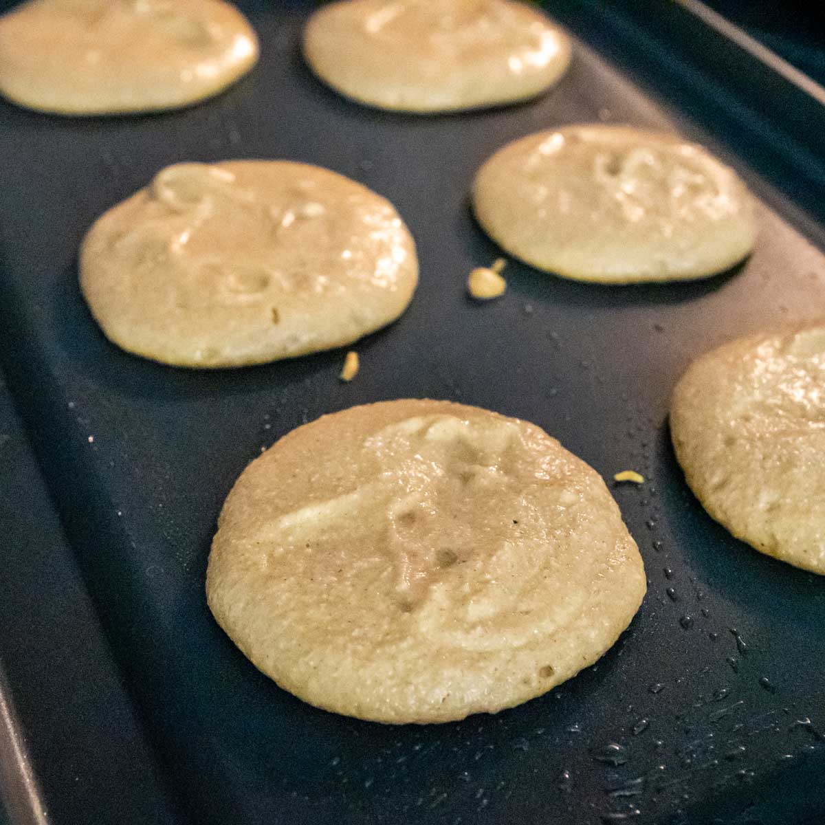 pancake batter on a griddle.
