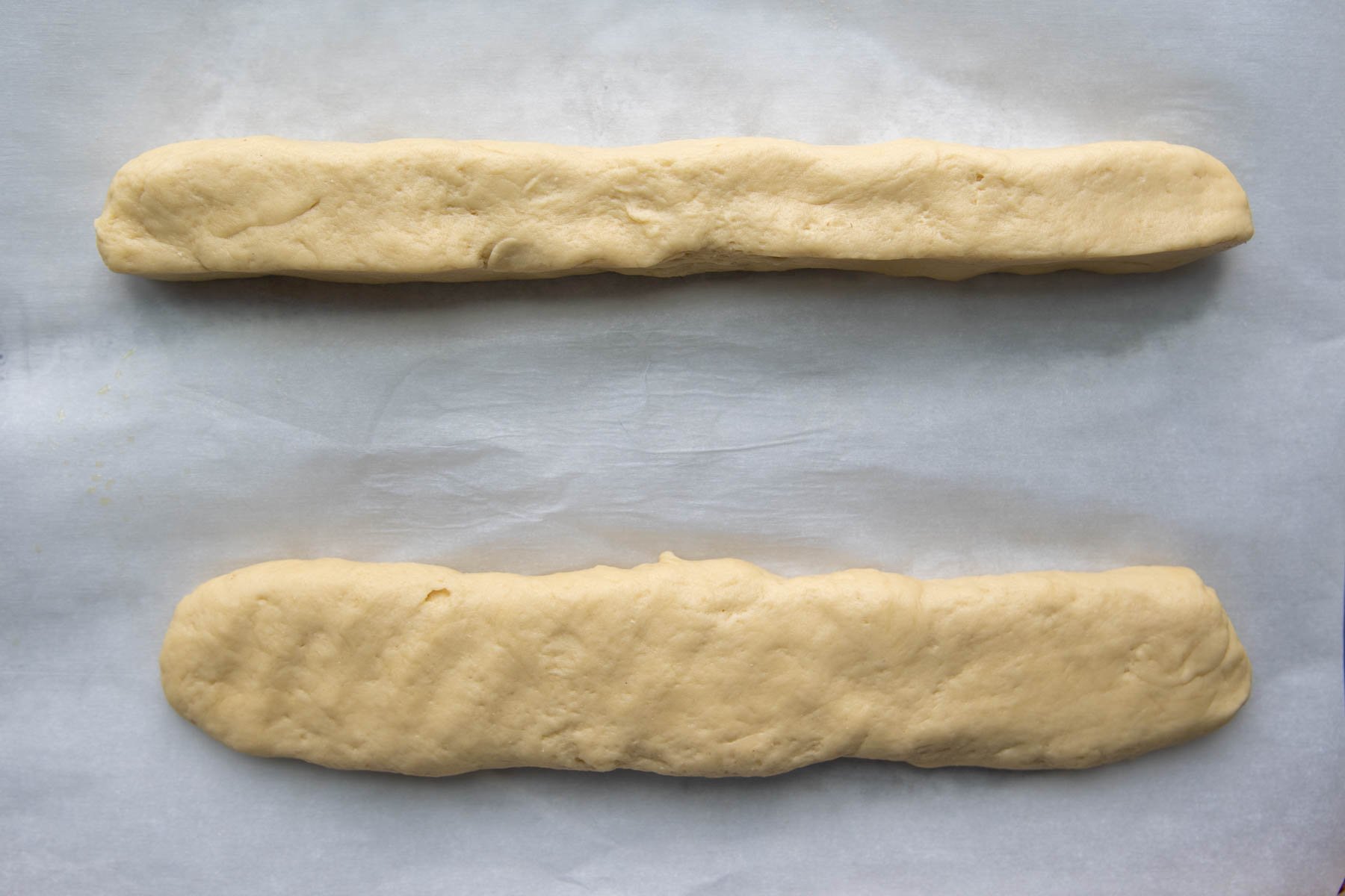 Pinch the dough into a 12-inch log then flatten.