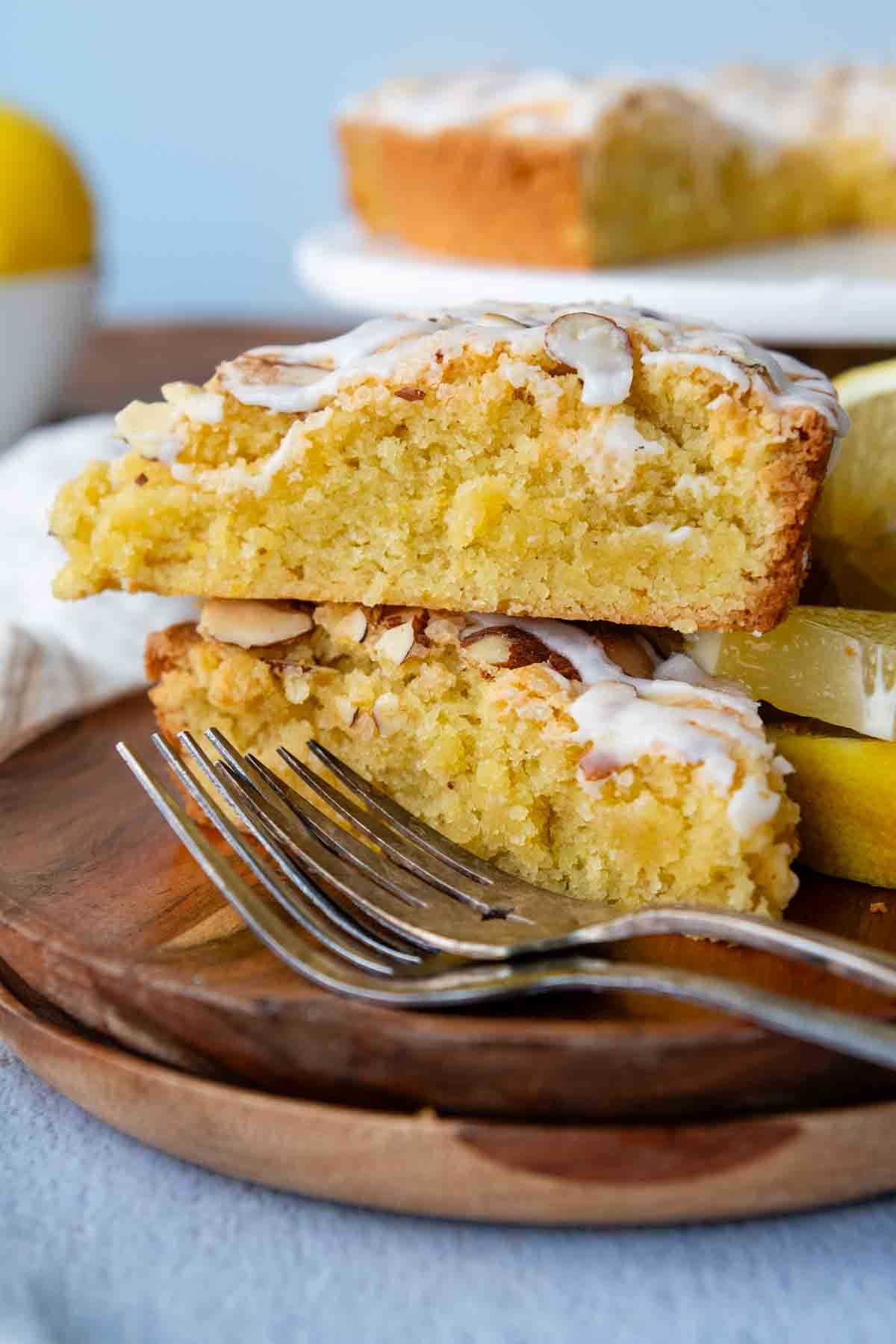 a stack of two slices of lemon almond cake.