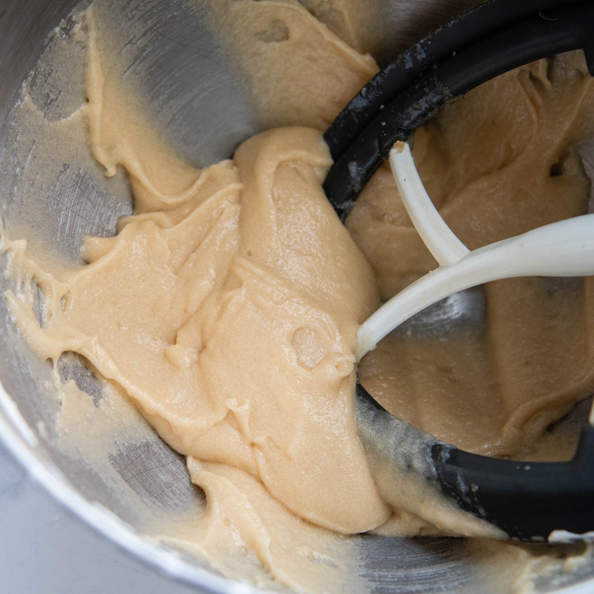 the banana cake batter after the fats and sugars are combined.
