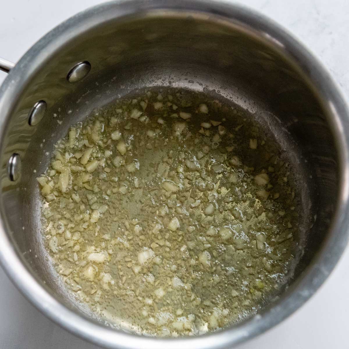 garlic being sauted in butter.