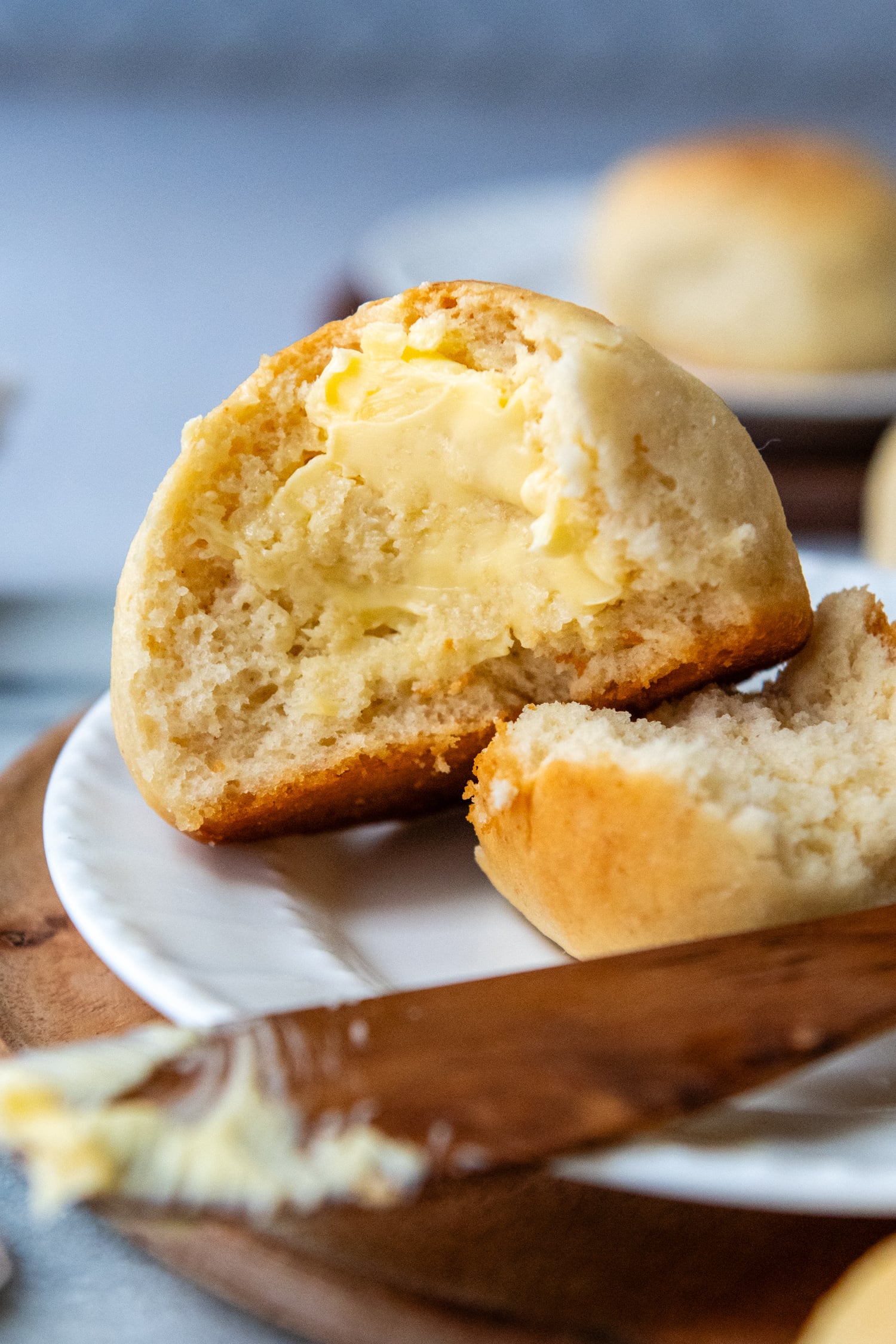 Roll torn open with butter on it.