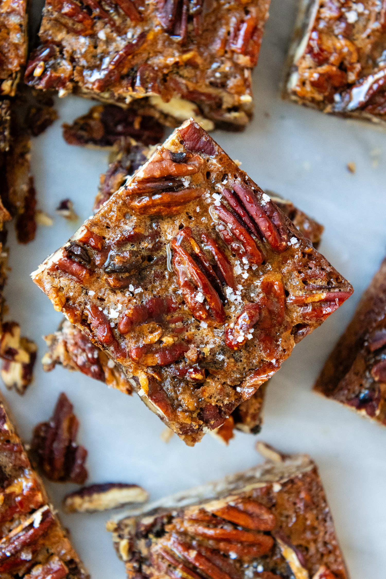 Overhead shot of bars showing detail of pecan crust.