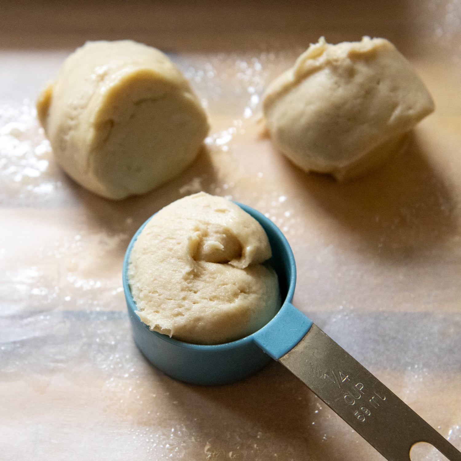 Dough in a measuring spoon.