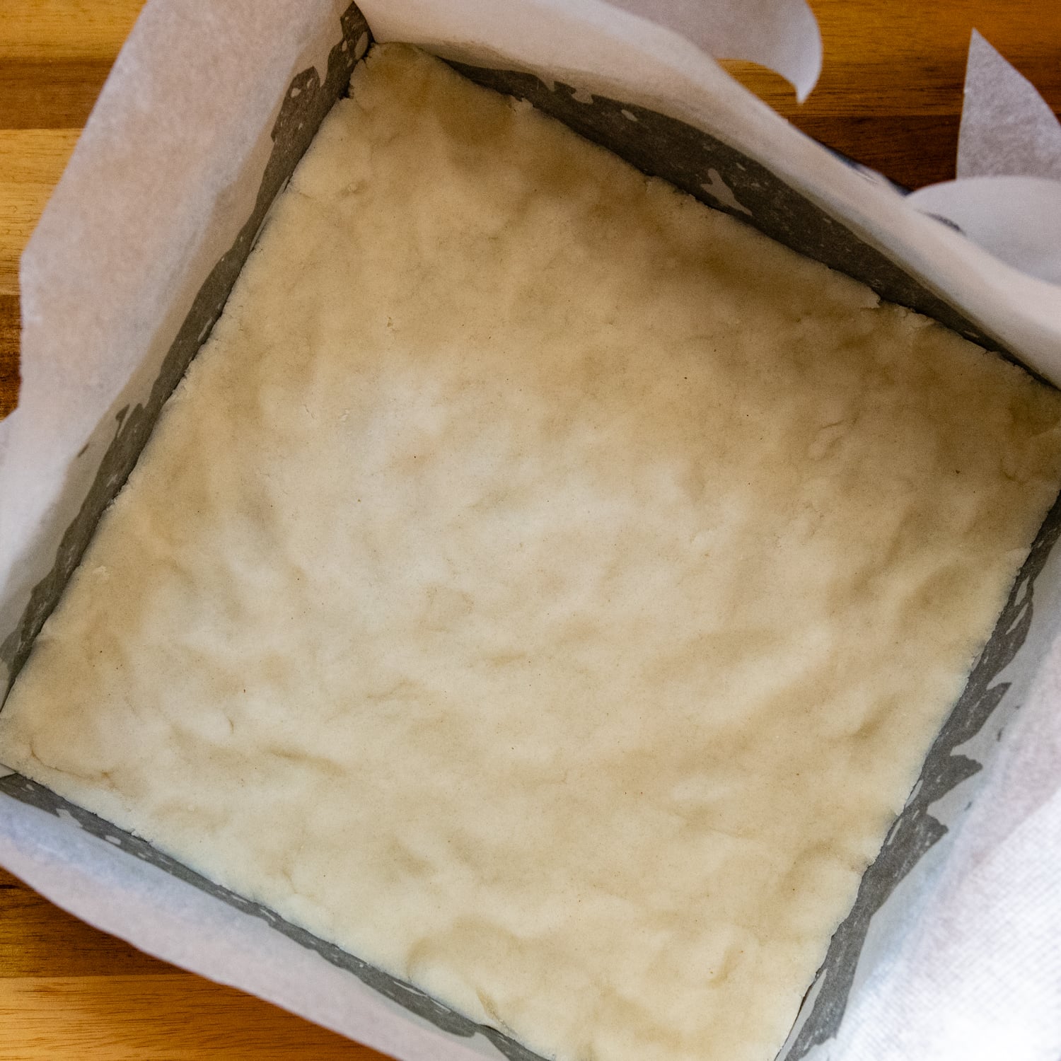 Dough pressed into prepared baking pan.