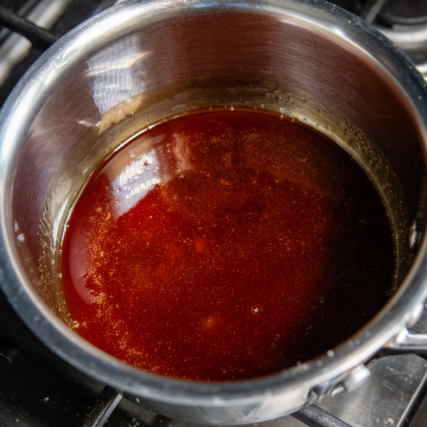 Hot and melted caramel ingredients in a sauce pan.
