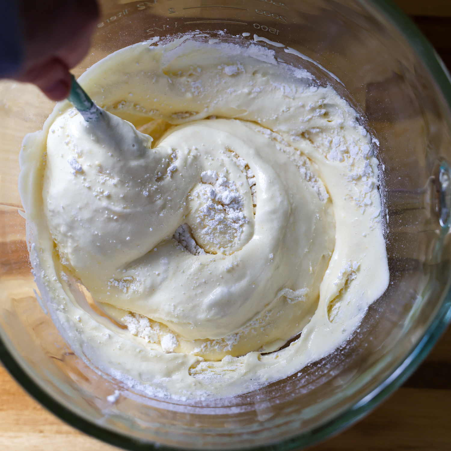 Flour mixture being added to egg mixture.