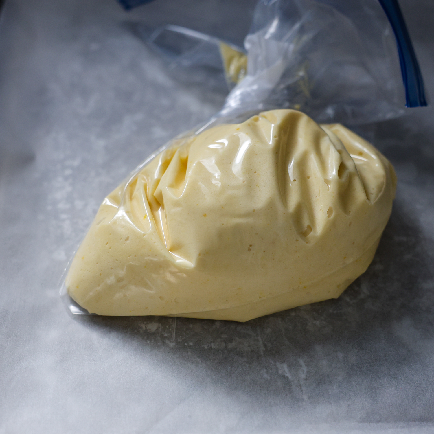 Bag with batter in it squeezed to get air out of it.