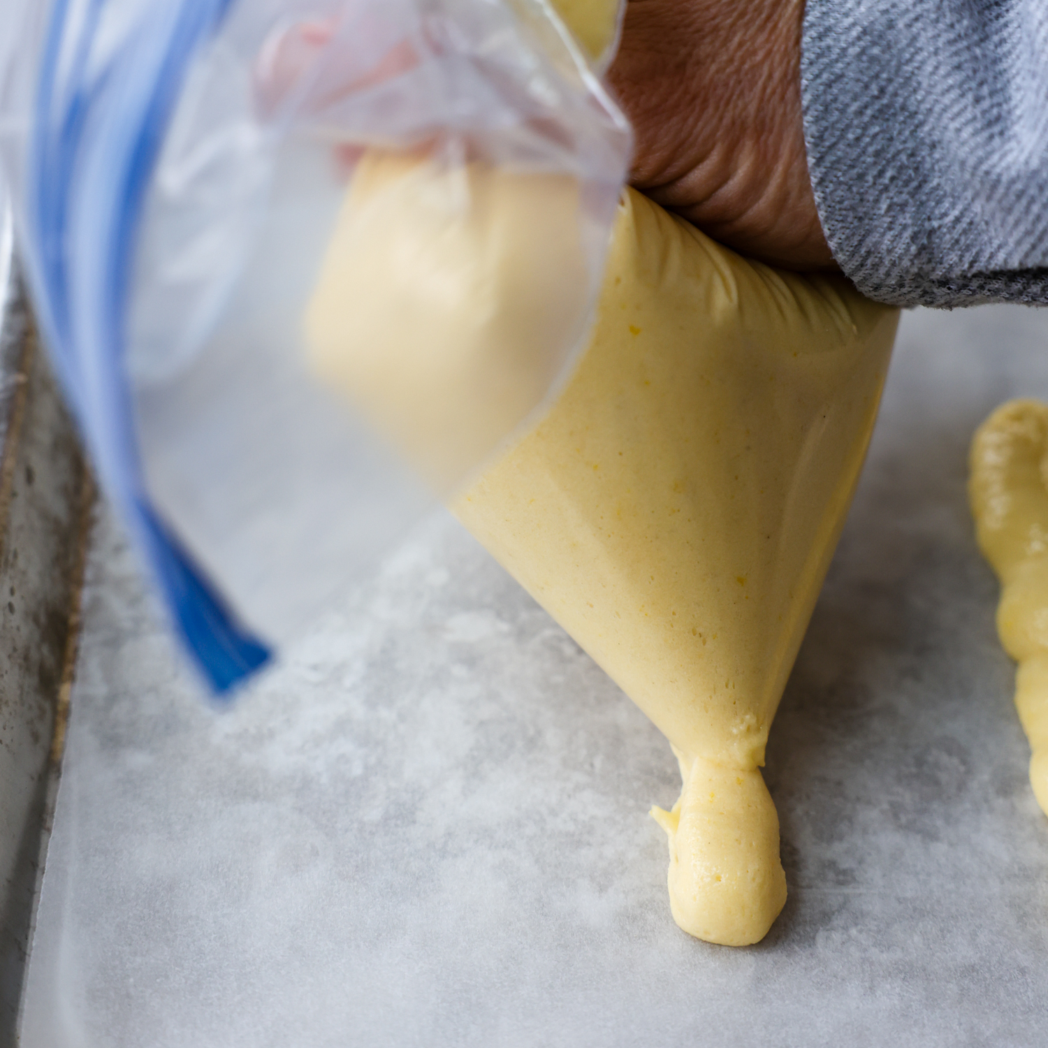 Batter being piped out of a bag.