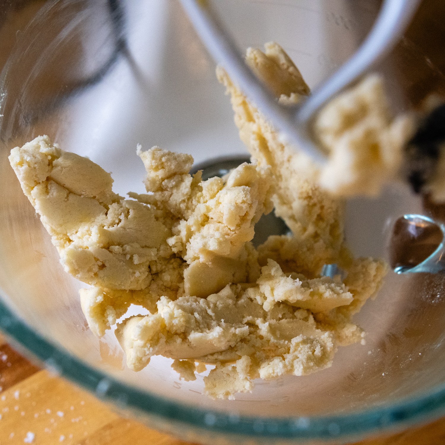 Shortbread mixture in a glass mixing bowl.