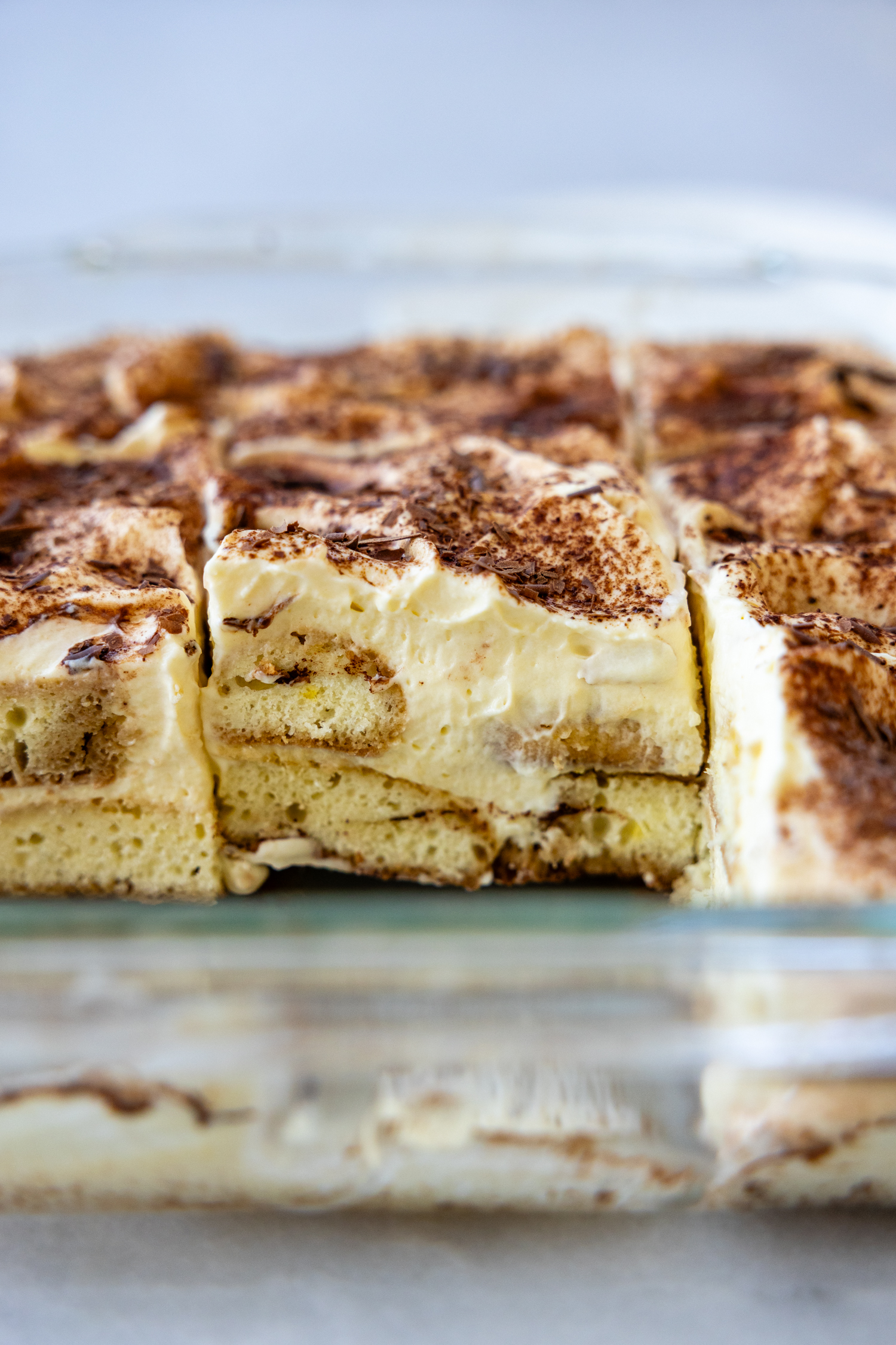 Tiramisu in glass baking dish.