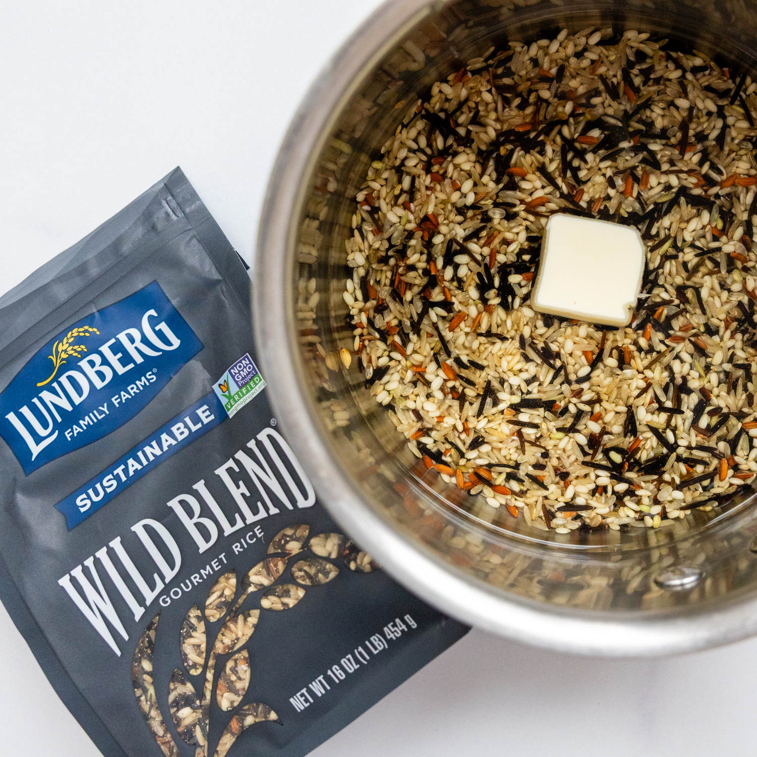 Pot of rice, rice package and butter.