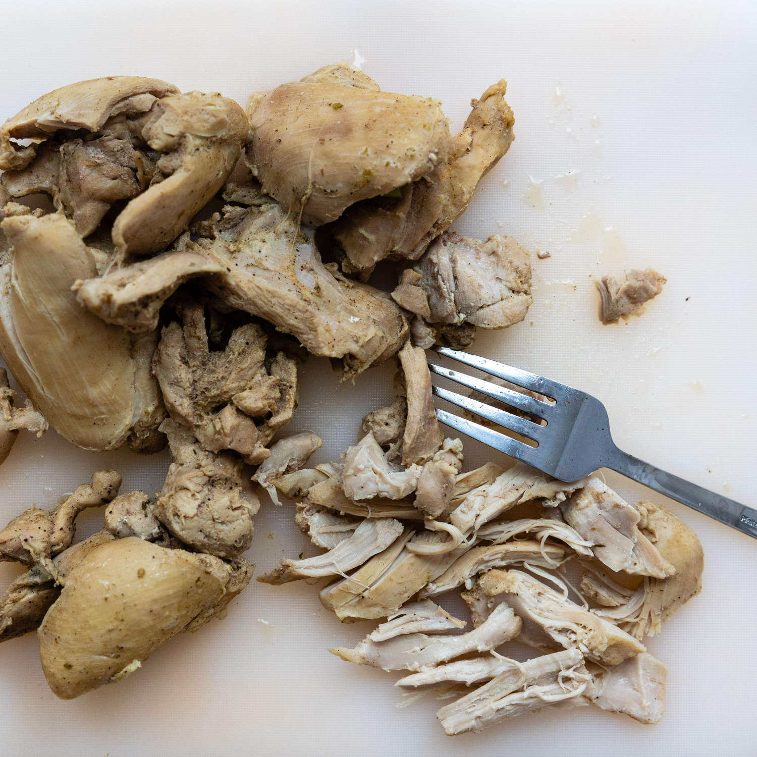 Fork shredding chicken.