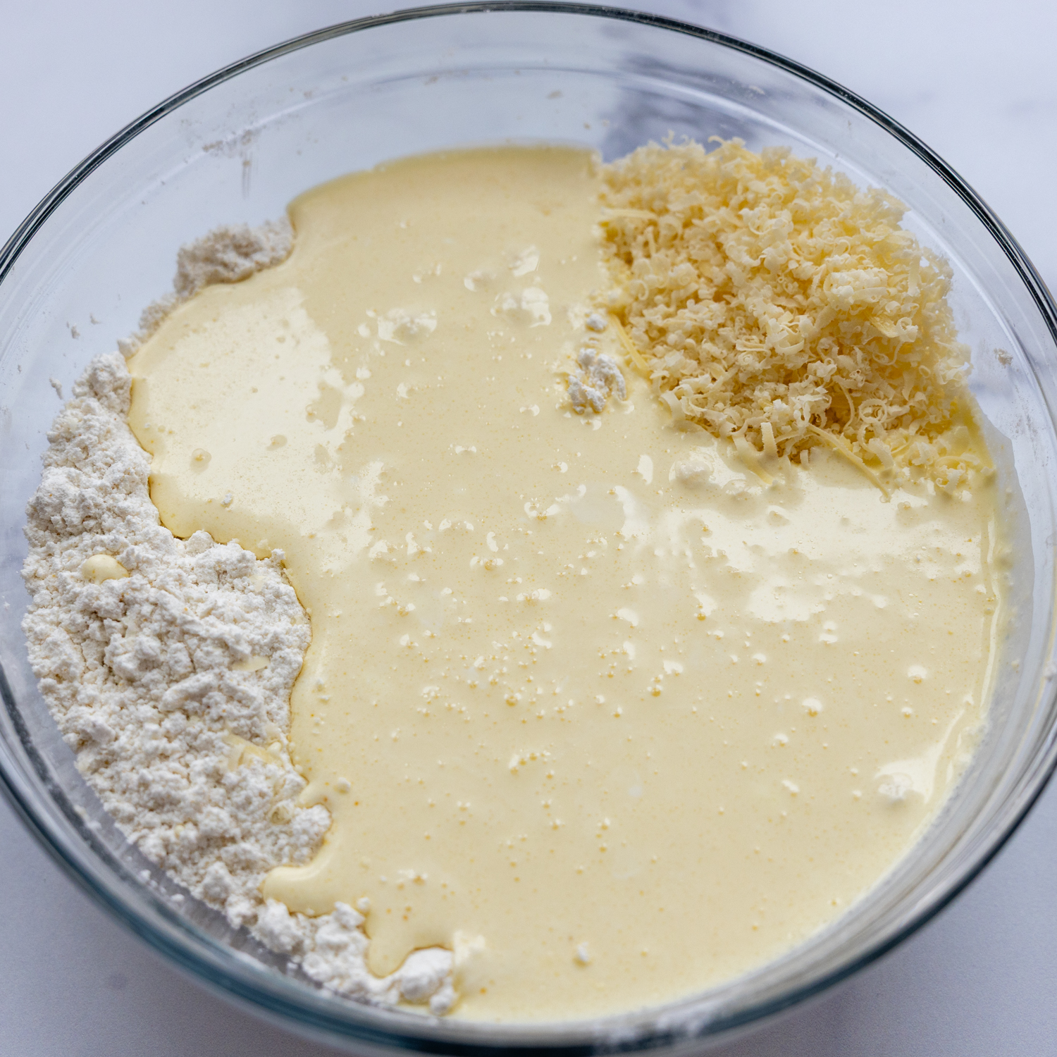 Biscuit ingredients in a glass bowl.