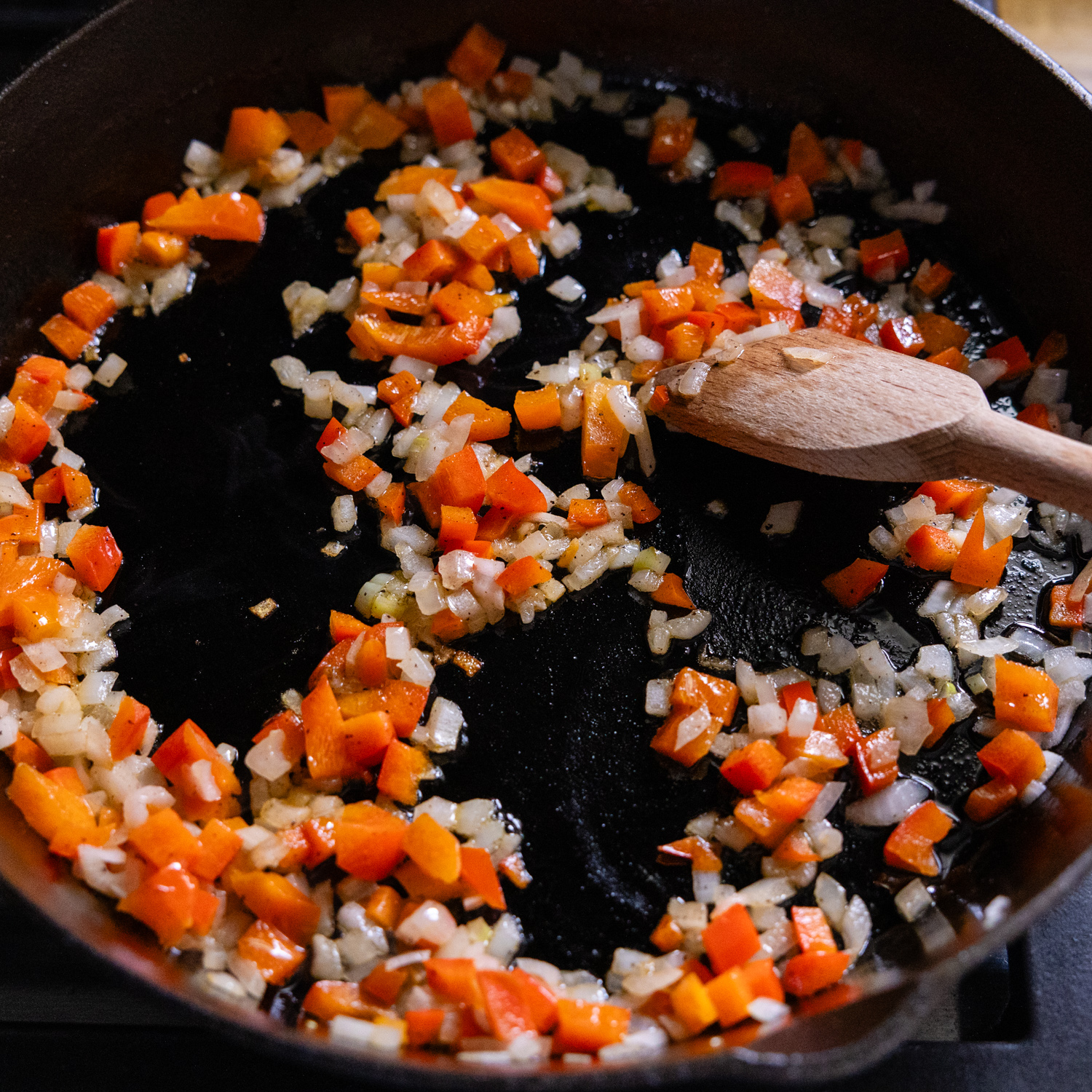 Veggies being sautéed in a skillet.