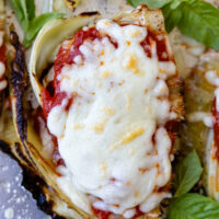 top view of cabbage parmesan with bubbly browned cheese on top.