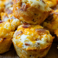 two savory muffins stacked on top of each other.