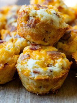 two savory muffins stacked on top of each other.