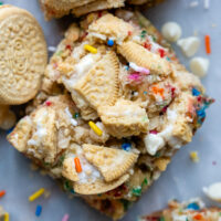 overhead shot of funfetti bars with crushed Oreos on top and a couple Golden Oreos laying next to it.