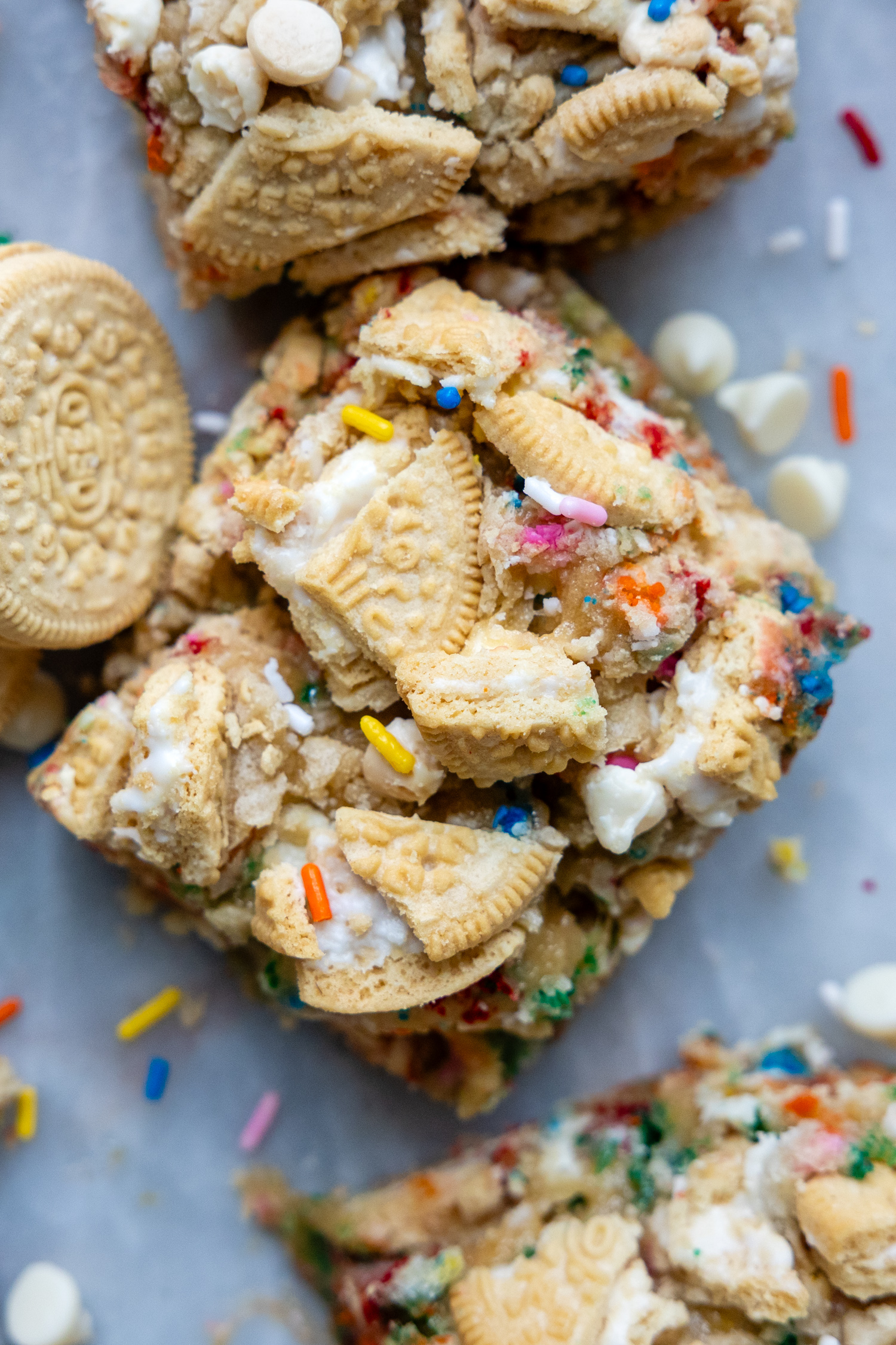 overhead shot of funfetti bars with crushed Oreos on top and a couple Golden Oreos laying next to it.