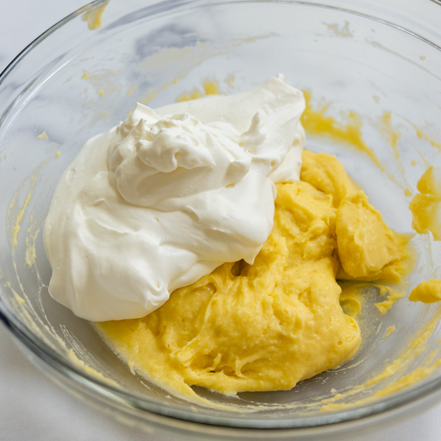 Frosting ingredients in glass bowl.