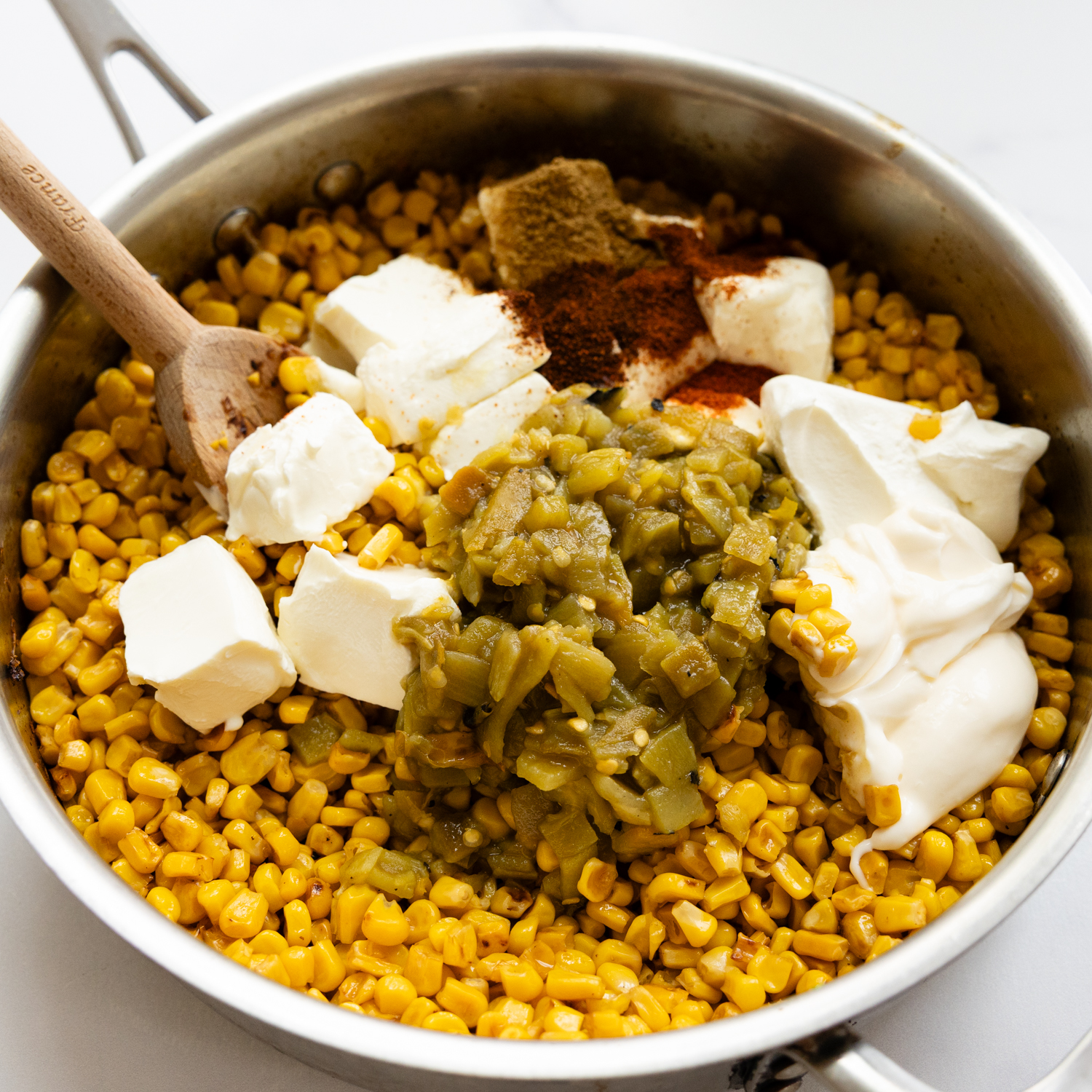 Ingredients added to charred corn.
