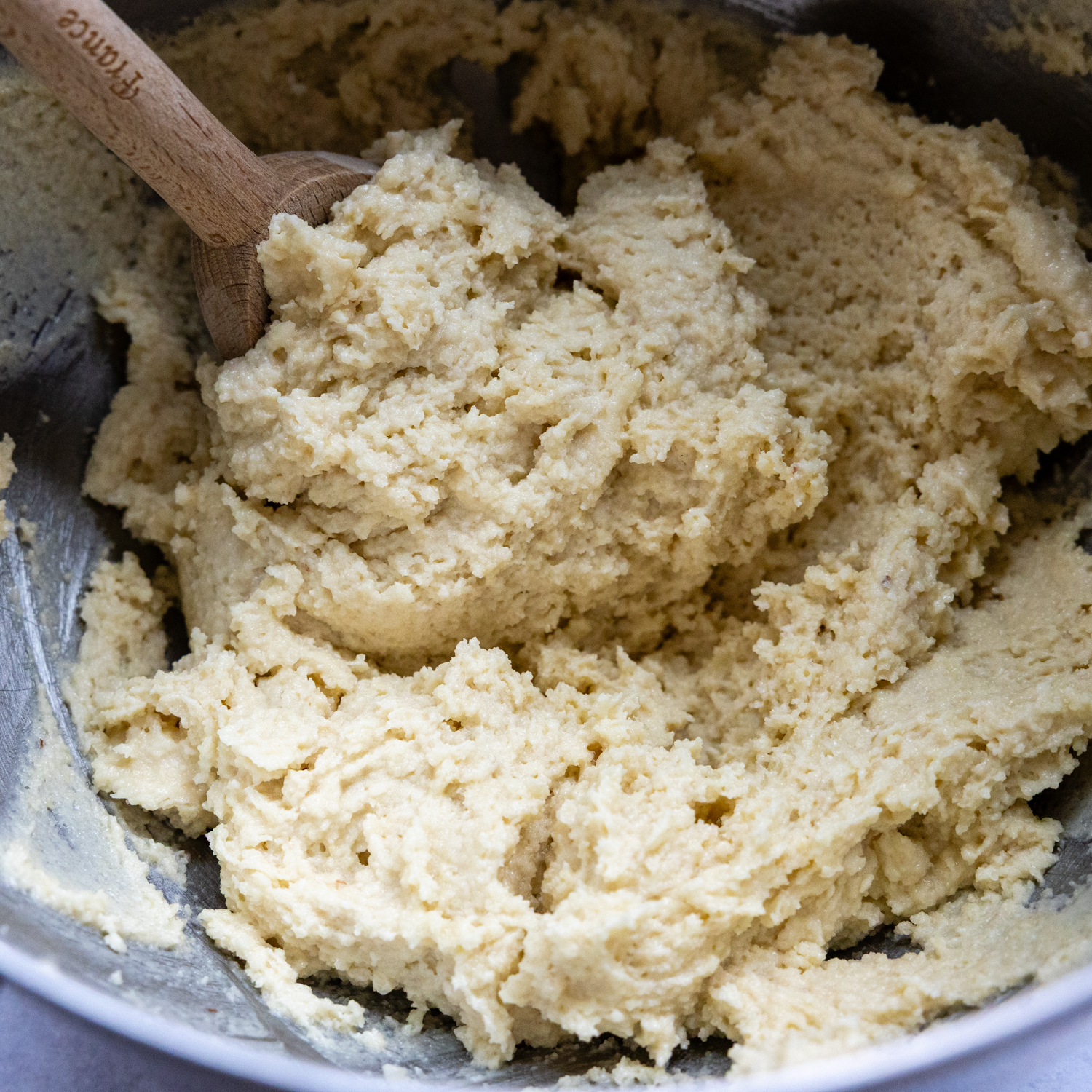 Cookie ingredients mixed together in bowl.
